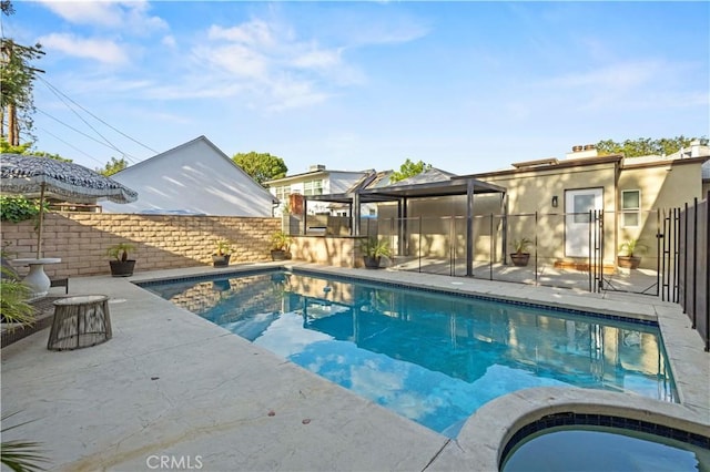 view of swimming pool with a fenced in pool, a patio, an in ground hot tub, and a fenced backyard