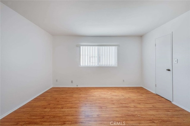 5400 Newcastle Ave Unit 56, Encino, CA 91316 - unfurnished room with baseboards and light wood-type flooring