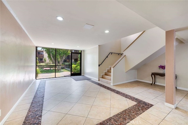 5400 Newcastle Ave Unit 56, Encino, CA 91316 - entryway with baseboards, stairway, recessed lighting, floor to ceiling windows, and tile patterned floors