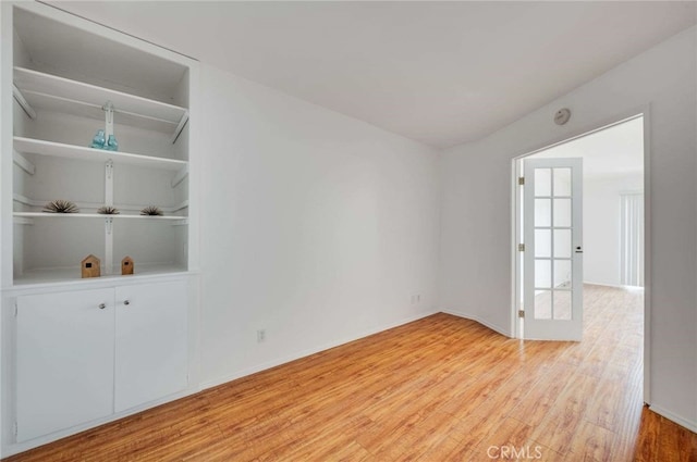5400 Newcastle Ave Unit 56, Encino, CA 91316 - unfurnished room featuring baseboards and light wood-style flooring