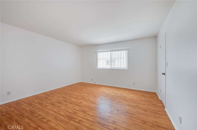 5400 Newcastle Ave Unit 56, Encino, CA 91316 - empty room with baseboards and light wood-style flooring