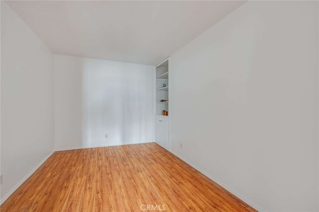 5400 Newcastle Ave Unit 56, Encino, CA 91316 - empty room with light wood-type flooring and built in features