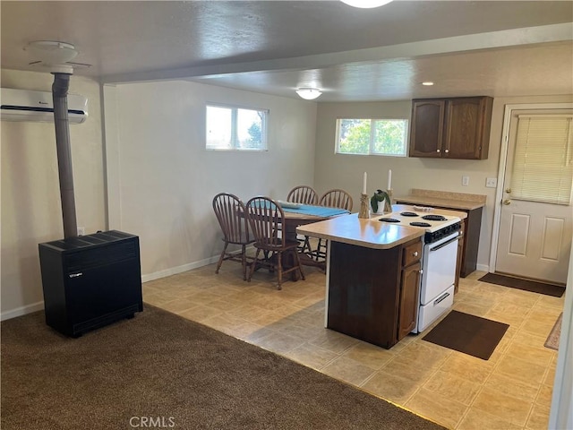 6322 Harvey, Paradise, CA 95969 - kitchen featuring light countertops, baseboards, a wall mounted air conditioner, and electric stove