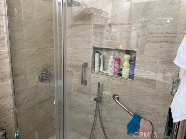 bathroom featuring a shower stall