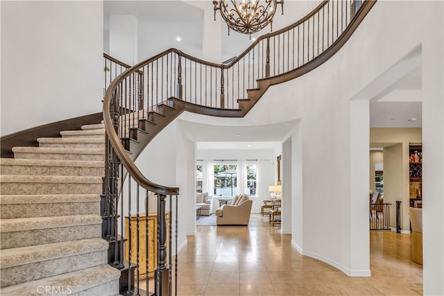 27 Calle Canela, San Clemente, CA 92673 - tiled entryway with baseboards, stairs, and a chandelier