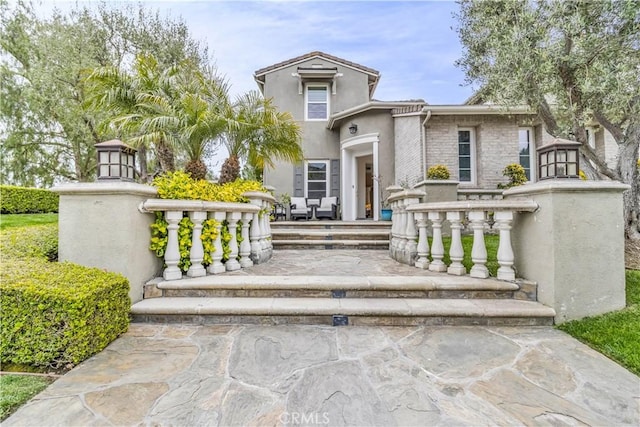 27 Calle Canela, San Clemente, CA 92673 - view of front facade with stucco siding and stone siding