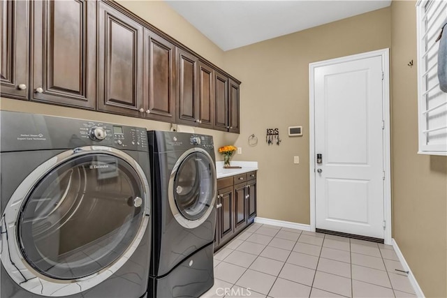 27 Calle Canela, San Clemente, CA 92673 - laundry area with baseboards, cabinet space, independent washer and dryer, and light tile patterned floors
