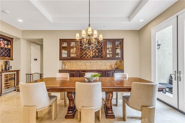 27 Calle Canela, San Clemente, CA 92673 - dining room with an inviting chandelier, a raised ceiling, beverage cooler, recessed lighting, and a bar