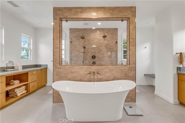 27 Calle Canela, San Clemente, CA 92673 - bathroom with visible vents, vanity, a soaking tub, and tiled shower