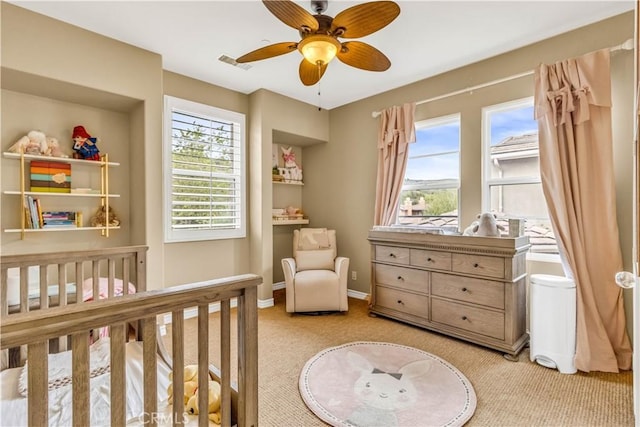 27 Calle Canela, San Clemente, CA 92673 - bedroom featuring visible vents, light carpet, baseboards, ceiling fan, and a nursery area