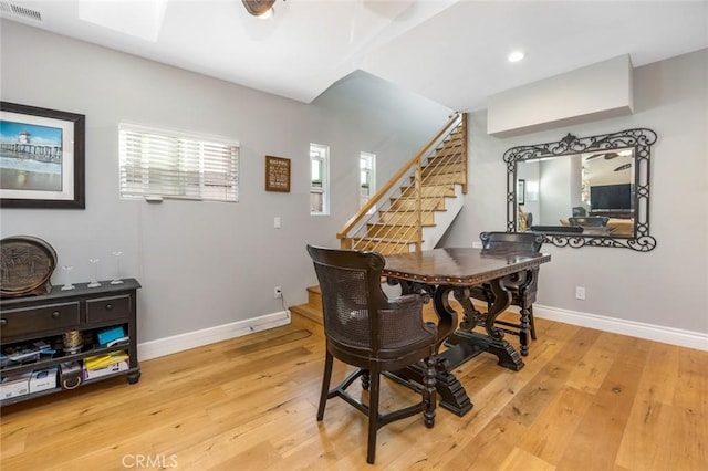 16512 23rd St, Sunset Beach, CA 90742 - dining area featuring light wood-type flooring, visible vents, baseboards, and stairway