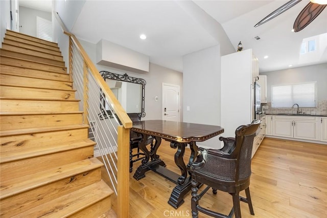 16512 23rd St, Sunset Beach, CA 90742 - dining space with stairway, light wood-type flooring, recessed lighting, and vaulted ceiling