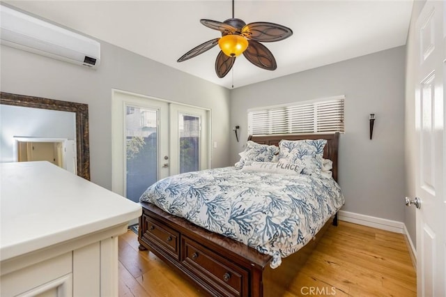16512 23rd St, Sunset Beach, CA 90742 - bedroom featuring french doors, access to exterior, light wood-type flooring, baseboards, and an AC wall unit