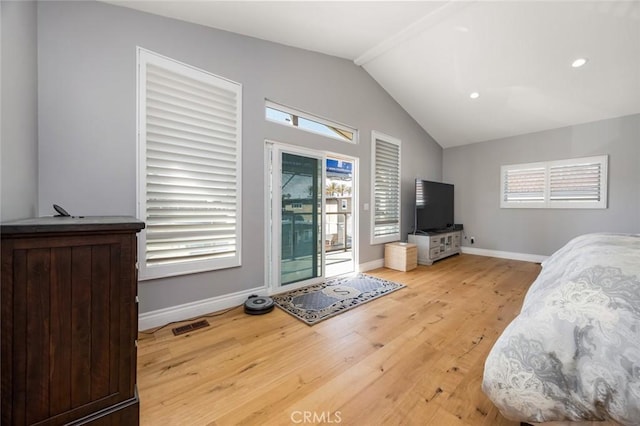 16512 23rd St, Sunset Beach, CA 90742 - living area featuring vaulted ceiling, baseboards, a healthy amount of sunlight, and wood finished floors