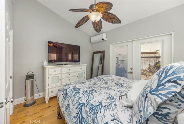 16512 23rd St, Sunset Beach, CA 90742 - bedroom with lofted ceiling, light wood-style flooring, a wall mounted AC, a ceiling fan, and baseboards