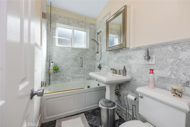 16512 23rd St, Sunset Beach, CA 90742 - full bathroom with toilet, tile walls, and combined bath / shower with glass door