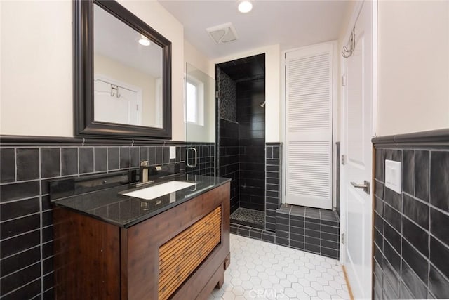 16512 23rd St, Sunset Beach, CA 90742 - full bathroom with tile walls, tiled shower, vanity, recessed lighting, and tile patterned floors