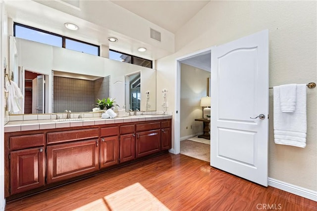 2223 E Vista Mesa Way, Orange, CA 92867 - bathroom with double vanity, wood finished floors, and baseboards