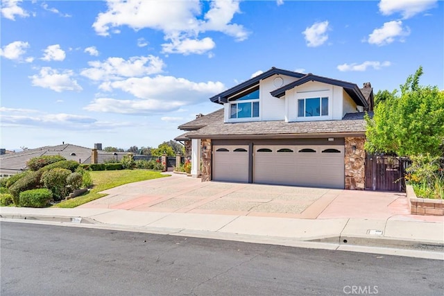 2223 E Vista Mesa Way, Orange, CA 92867 - view of front facade featuring stone siding, a garage, concrete driveway, and a chimney