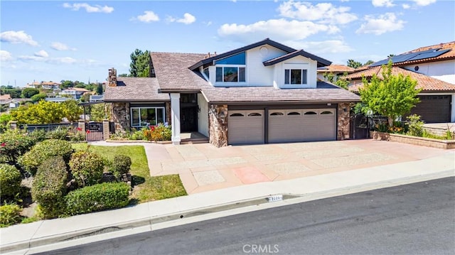 2223 E Vista Mesa Way, Orange, CA 92867 - view of front of house with stone siding, a garage, concrete driveway, and a chimney