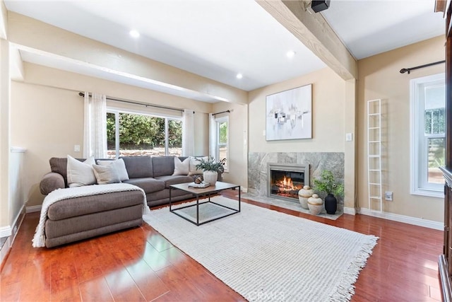 2223 E Vista Mesa Way, Orange, CA 92867 - living area featuring wood finished floors, healthy amount of natural light, a premium fireplace, baseboards, and beam ceiling