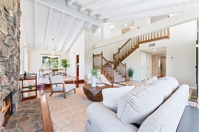 2223 E Vista Mesa Way, Orange, CA 92867 - living area featuring stairs, high vaulted ceiling, baseboards, a stone fireplace, and wood ceiling with exposed beams