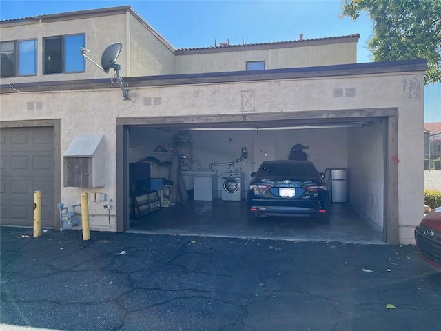 garage with aphalt driveway