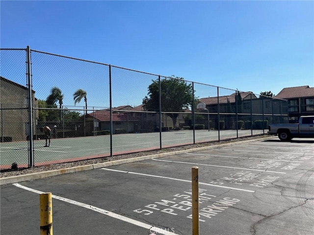 view of sport court featuring fence and community basketball court