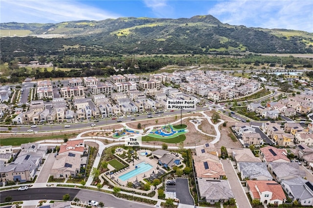 birds eye view of property with a residential view and a mountain view