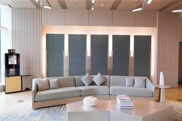 living room with beamed ceiling