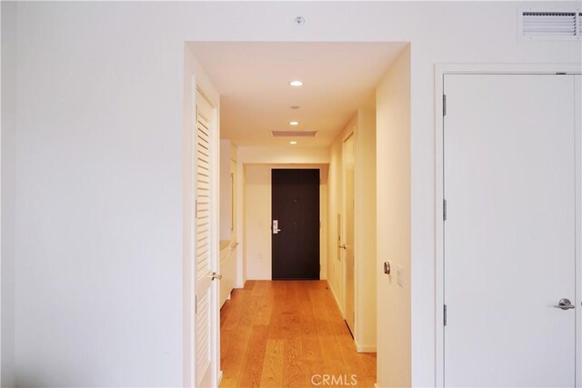 corridor featuring recessed lighting, light wood-style flooring, and visible vents