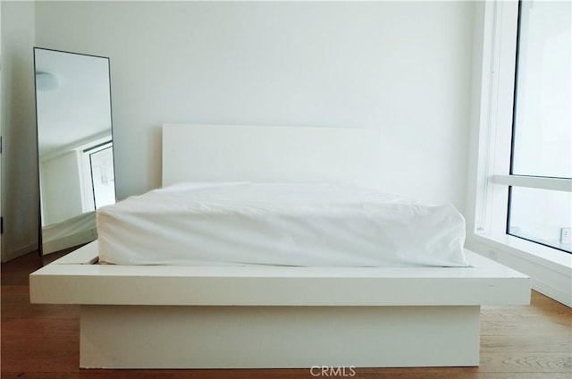 bedroom with wood finished floors