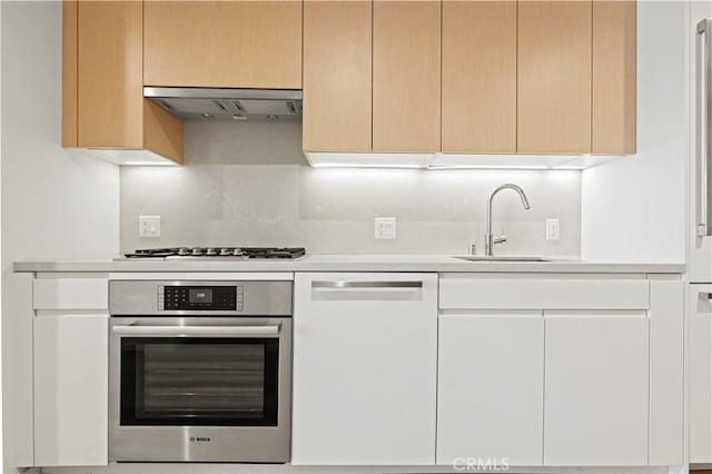877 Francisco St Unit 1723, Los Angeles, CA 90017 - kitchen with stainless steel oven, dishwashing machine, a sink, and light countertops