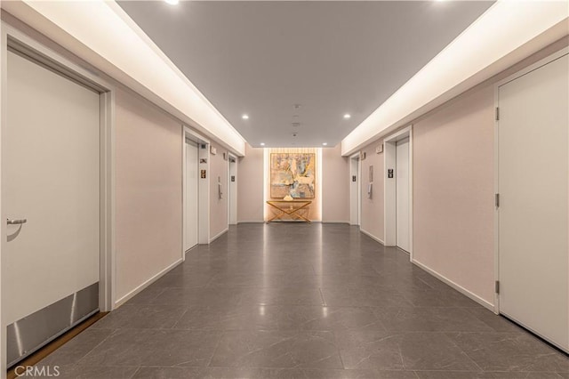 877 Francisco St Unit 1723, Los Angeles, CA 90017 - hall with recessed lighting, elevator, and baseboards