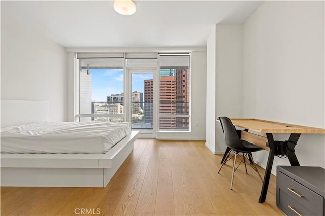 877 Francisco St Unit 1723, Los Angeles, CA 90017 - bedroom with access to exterior and light wood-style floors