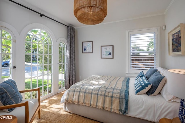 carpeted bedroom with crown molding and multiple windows