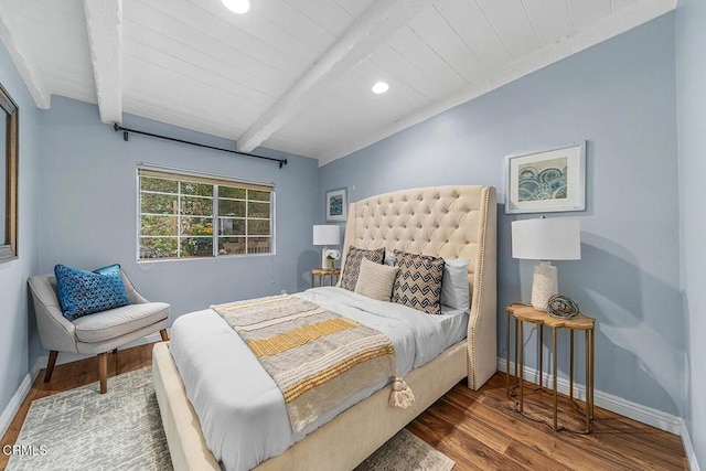 bedroom with recessed lighting, baseboards, beam ceiling, and wood finished floors