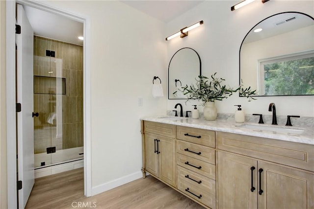 2583 King Way, Claremont, CA 91711 - full bath with double vanity, visible vents, a sink, and wood finished floors