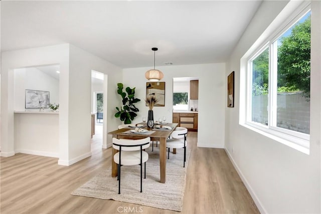 2583 King Way, Claremont, CA 91711 - dining room featuring baseboards, plenty of natural light, and light wood-type flooring