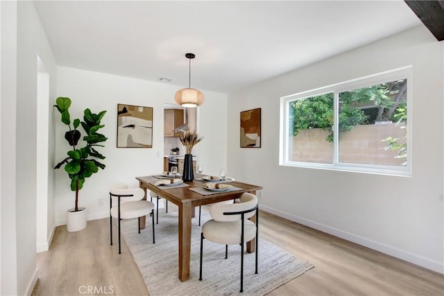 2583 King Way, Claremont, CA 91711 - dining space featuring light wood finished floors, baseboards, and a desk