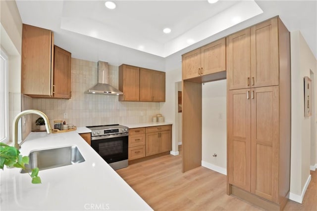 2583 King Way, Claremont, CA 91711 - kitchen with stainless steel electric range oven, wall chimney range hood, a tray ceiling, a sink, and recessed lighting