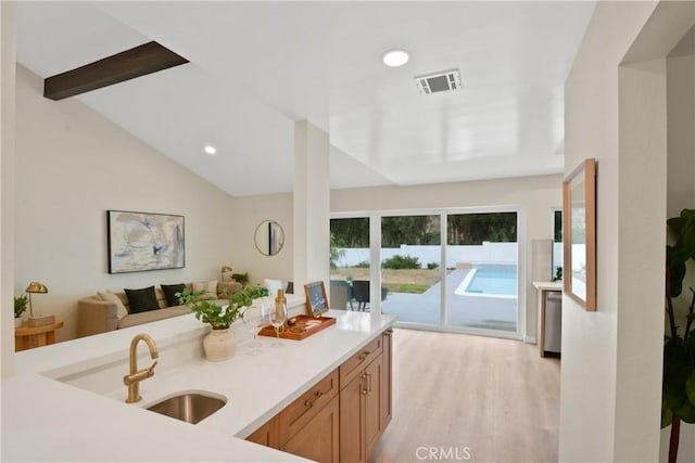 2583 King Way, Claremont, CA 91711 - kitchen with a sink, light countertops, light wood-style flooring, open floor plan, and recessed lighting