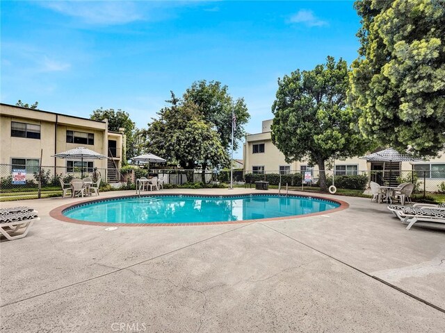 11813 Runnymede St Unit 44, North Hollywood, CA 91605 - community pool featuring a patio area and fence