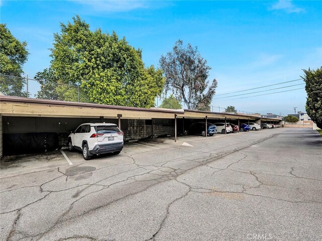 11813 Runnymede St Unit 44, North Hollywood, CA 91605 - covered parking lot with fence