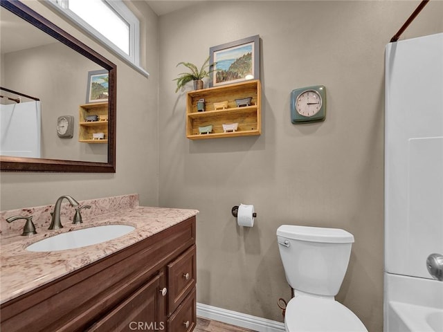 11813 Runnymede St Unit 44, North Hollywood, CA 91605 - bathroom featuring toilet, baseboards, vanity, and shower / bathing tub combination