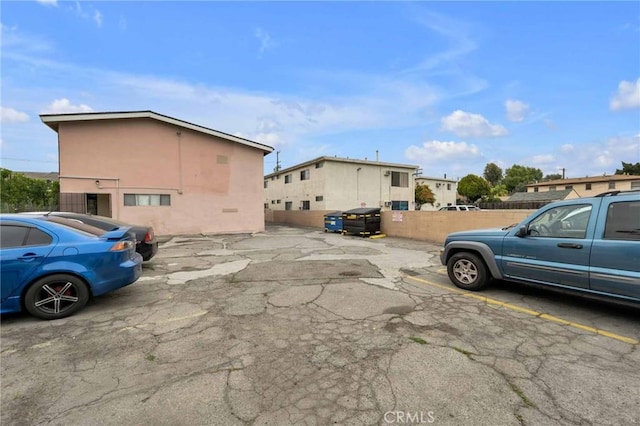 uncovered parking lot with fence