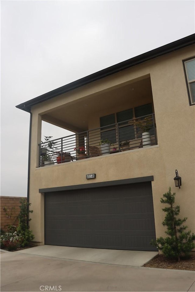 4211 E Malagon Privado Unit 66, Ontario, CA 91761 - contemporary house with an attached garage and stucco siding