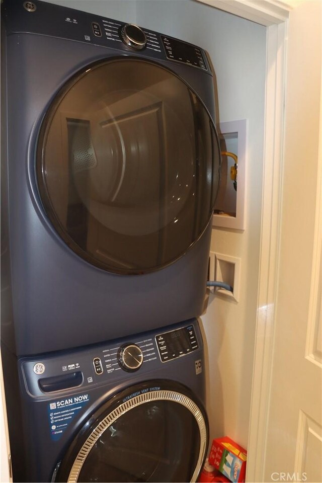 4211 E Malagon Privado Unit 66, Ontario, CA 91761 - washroom featuring laundry area and stacked washer / dryer