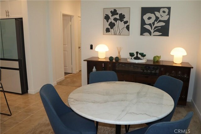 4211 E Malagon Privado Unit 66, Ontario, CA 91761 - dining room featuring baseboards and light tile patterned floors