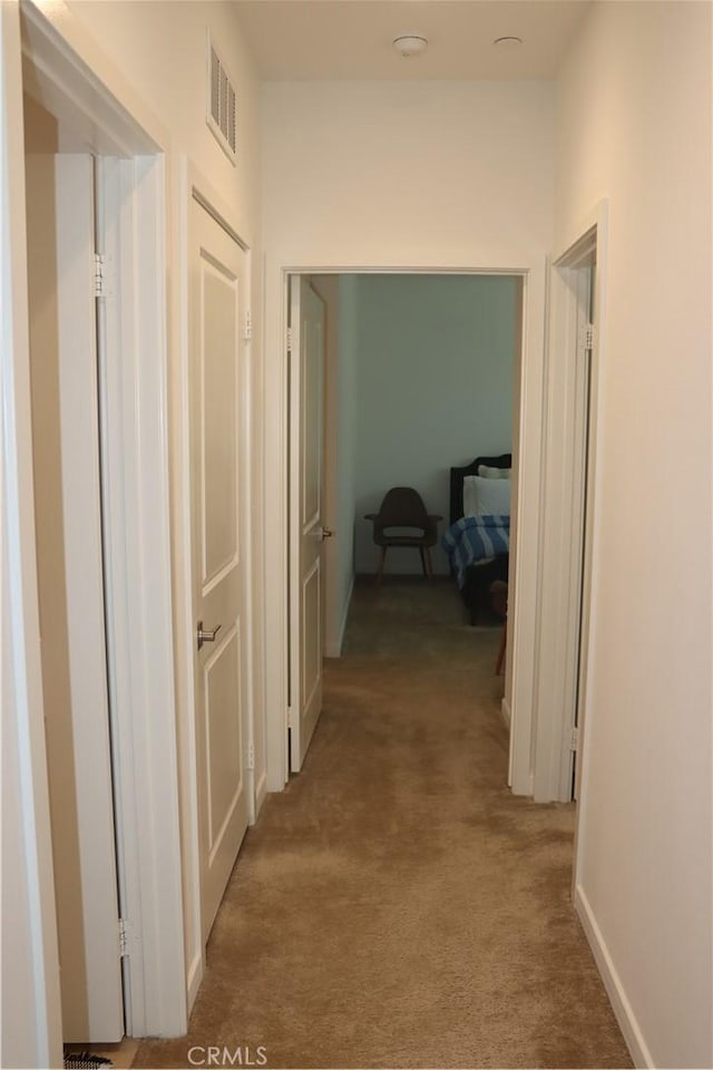 4211 E Malagon Privado Unit 66, Ontario, CA 91761 - corridor with visible vents and light carpet